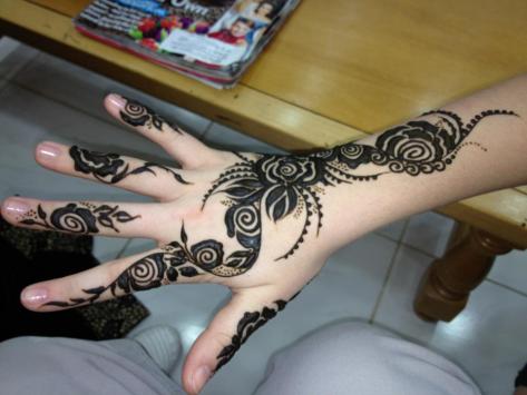 The teen's first henna.  Initially, it looked very dark, but that flakes off and you are left with the final product. 