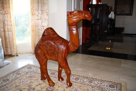 O'Humphrey the Camel.  He's a hand carved, Rosewood camel that was gifted to us by the nice folks at Al Barasty furniture store.  Because I've spent my husband's retirement shopping there.  I deserved a camel. 